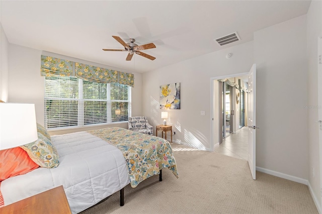 bedroom with light carpet and ceiling fan