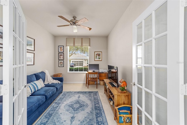 office space with french doors, ceiling fan, and carpet