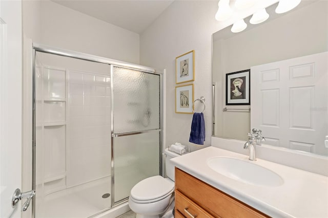 bathroom with vanity, toilet, and walk in shower