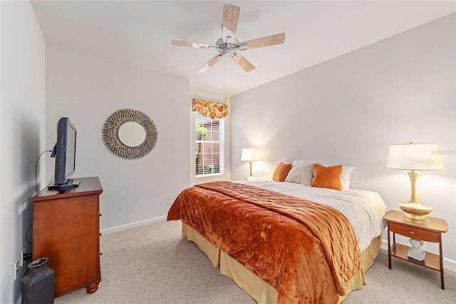 bedroom with ceiling fan and light colored carpet