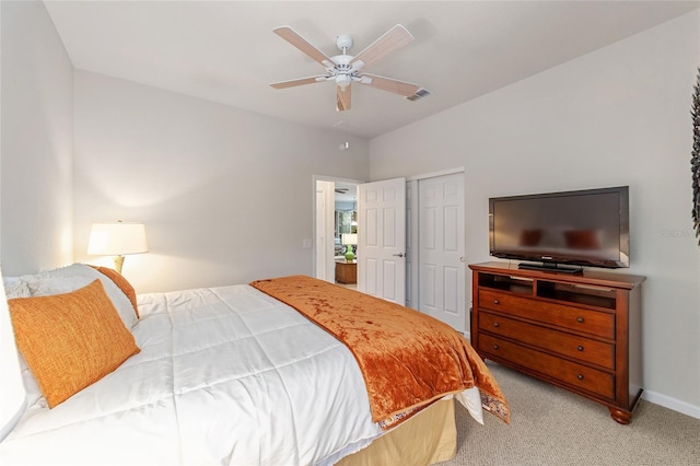 bedroom with light carpet, ceiling fan, and a closet