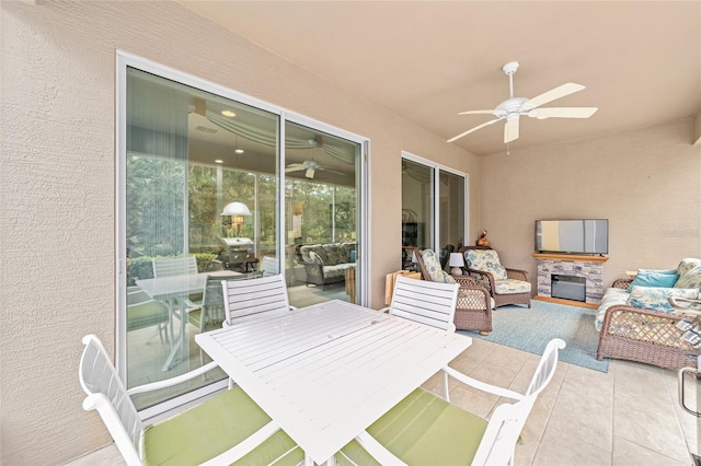 exterior space featuring ceiling fan and an outdoor hangout area