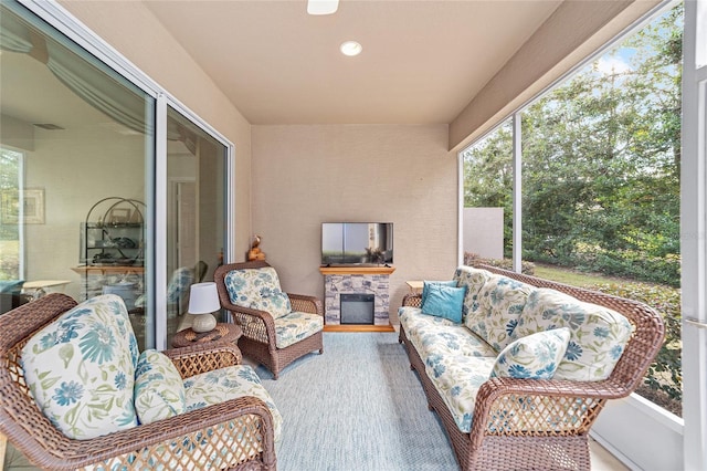 sunroom with a fireplace