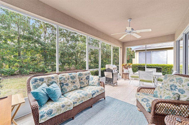 sunroom featuring a wealth of natural light and ceiling fan