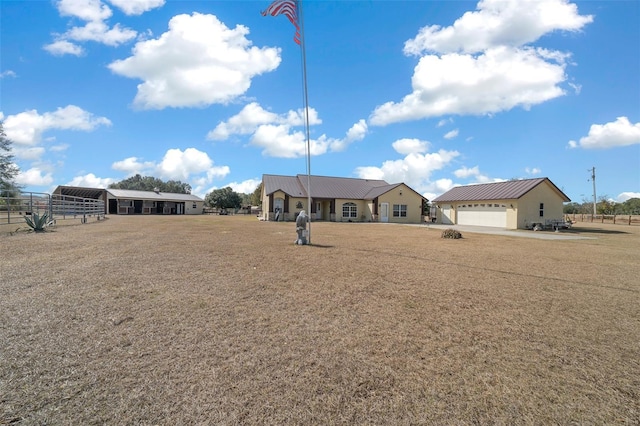 ranch-style house featuring an outbuilding