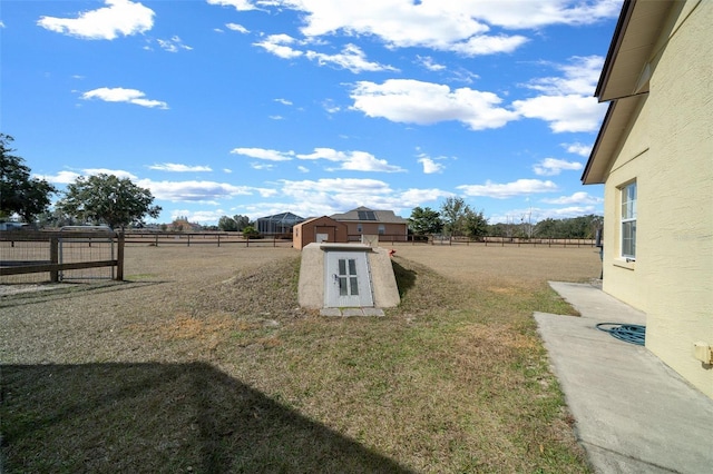 view of yard with a rural view