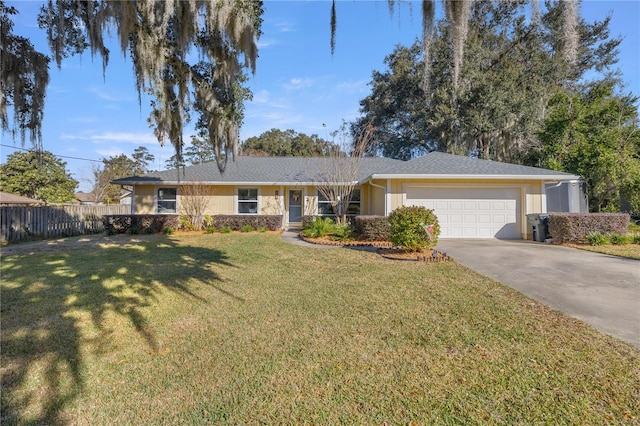 ranch-style house featuring a garage and a front yard