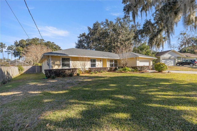 single story home featuring a garage and a front lawn