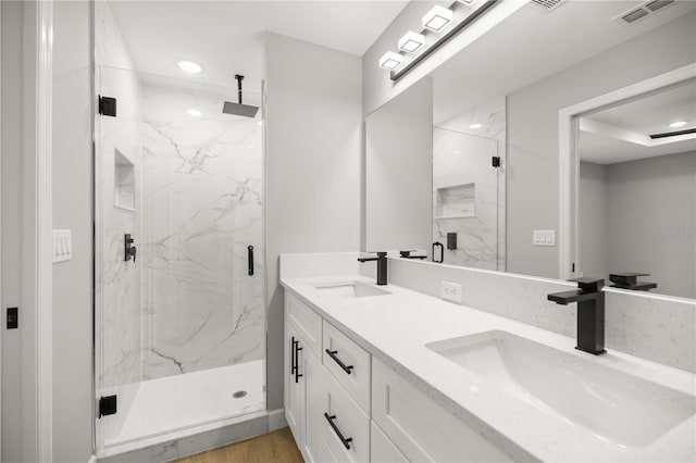 bathroom featuring vanity, hardwood / wood-style floors, and walk in shower