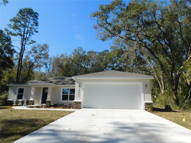 ranch-style home with a garage and a front lawn