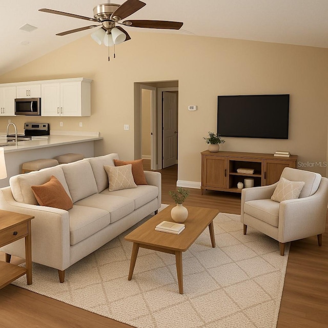 14268 SE 27th Ct, Summerfield, FL 34491 - living room featuring lofted ceiling, light wood-style floors, and ceiling fan