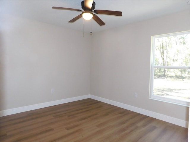 14268 SE 27th Ct, Summerfield, FL 34491 - empty room featuring healthy amount of natural light, wood finished floors, and ceiling fan