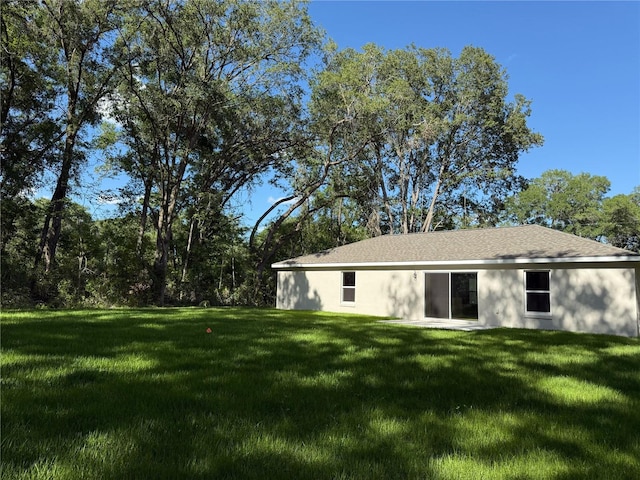 14268 SE 27th Ct, Summerfield, FL 34491 - back of house featuring a yard