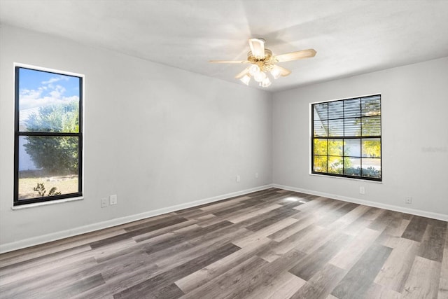 unfurnished room featuring ceiling fan and hardwood / wood-style floors