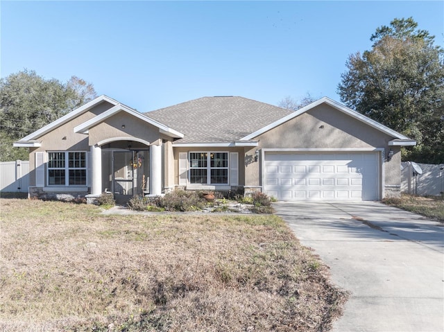 ranch-style home featuring a garage and a front yard