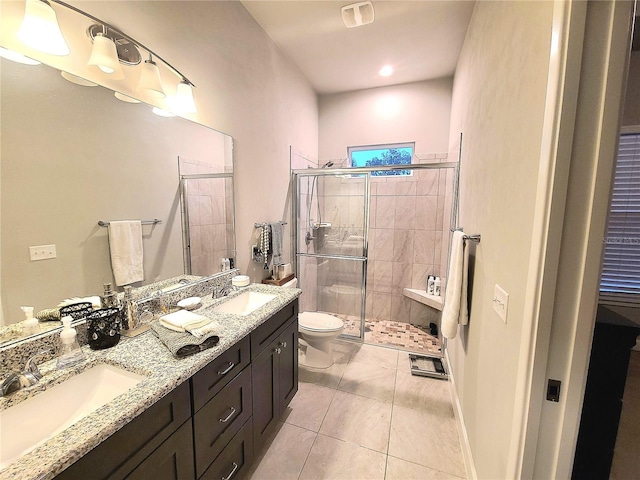 bathroom with tile patterned floors, toilet, an enclosed shower, and vanity