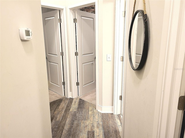 corridor featuring hardwood / wood-style floors