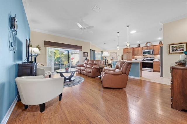 living room featuring crown molding, lofted ceiling, ceiling fan, and light wood-type flooring