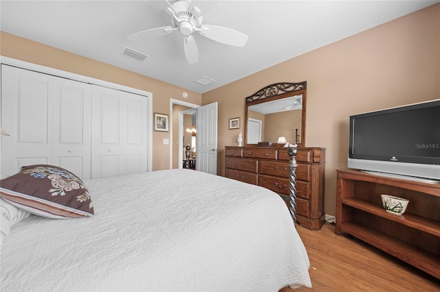 bedroom featuring a closet, ceiling fan, and light wood-type flooring