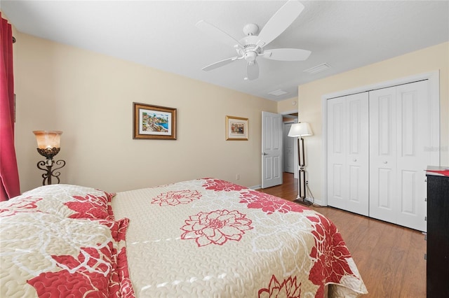 bedroom featuring hardwood / wood-style floors, a closet, and ceiling fan