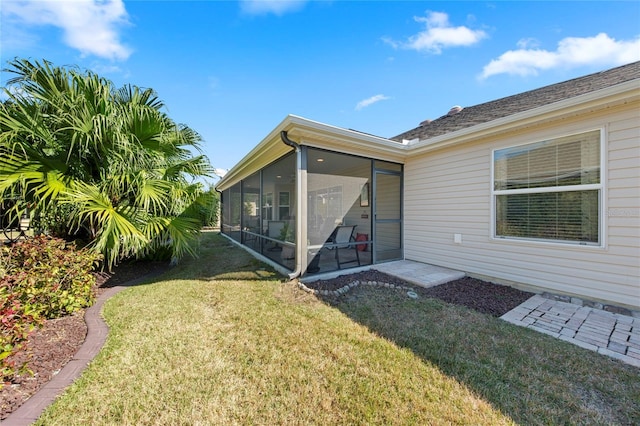 view of yard with a sunroom