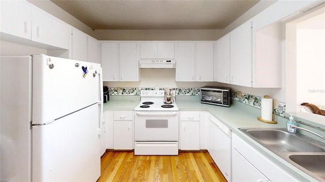 kitchen featuring light wood-type flooring, white appliances, sink, and white cabinets