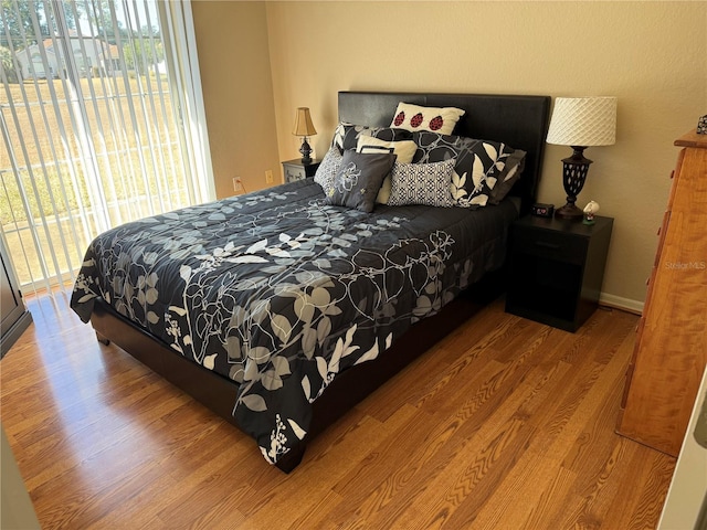 bedroom with wood-type flooring