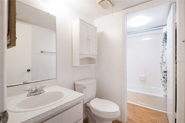 605 Midway Dr Unit B, Ocala, FL 34472 - bathroom with toilet, vanity, wood finished floors, and shower / bath combo