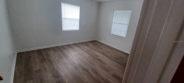 empty room featuring dark hardwood / wood-style floors