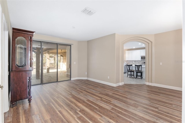 spare room with hardwood / wood-style flooring