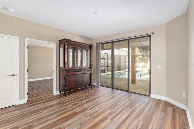 empty room with dark wood-type flooring