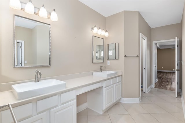 bathroom with tile patterned flooring and vanity