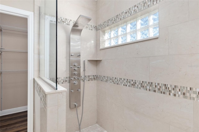 bathroom with tiled shower