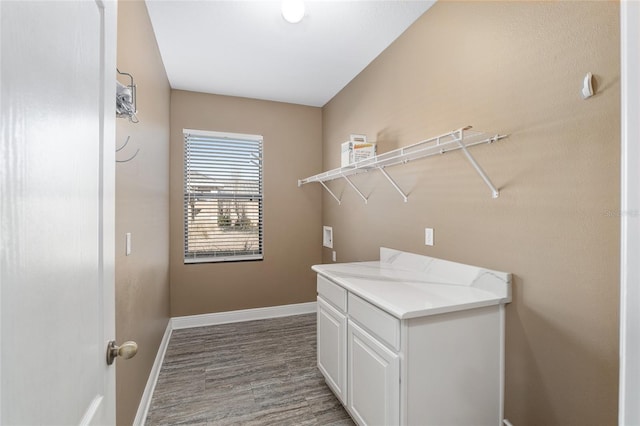 washroom featuring cabinets and washer hookup