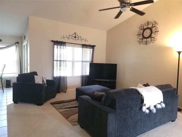 living room featuring ceiling fan, vaulted ceiling, and light carpet