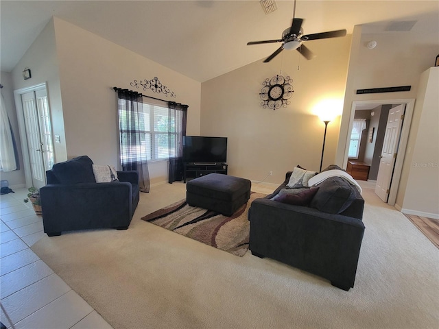 living room with ceiling fan and high vaulted ceiling