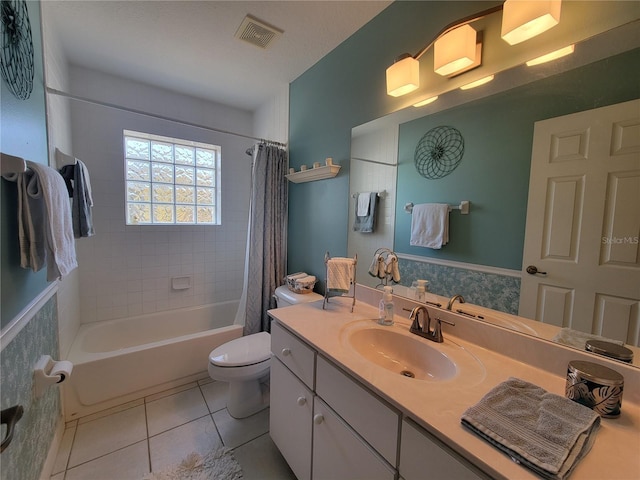 full bathroom featuring tile patterned flooring, vanity, shower / tub combo, and toilet