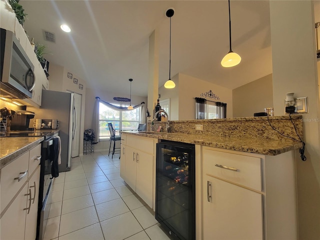 kitchen with pendant lighting, black electric range oven, sink, white cabinetry, and wine cooler