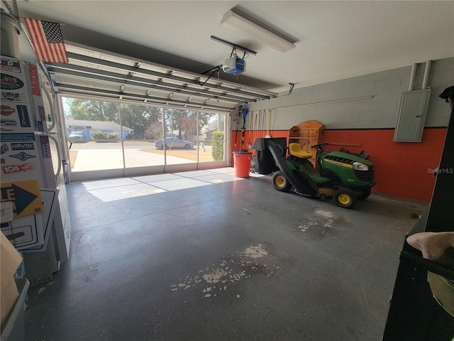 garage featuring a garage door opener and electric panel