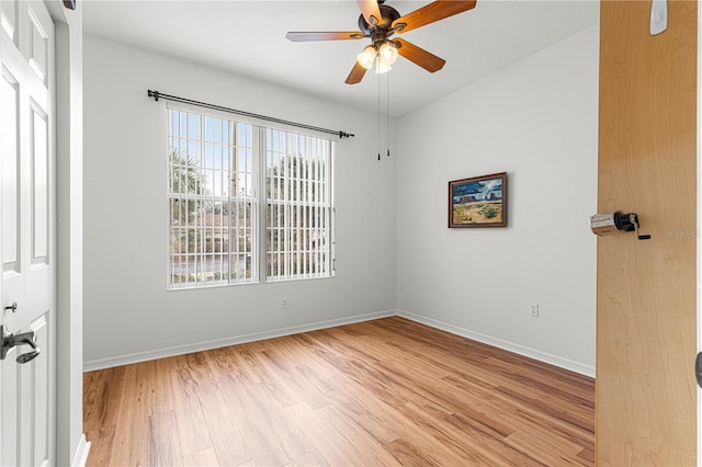 spare room with ceiling fan and light hardwood / wood-style floors