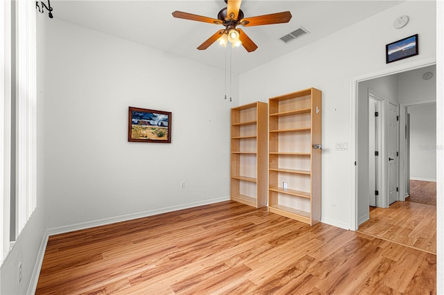 spare room with light hardwood / wood-style floors and ceiling fan