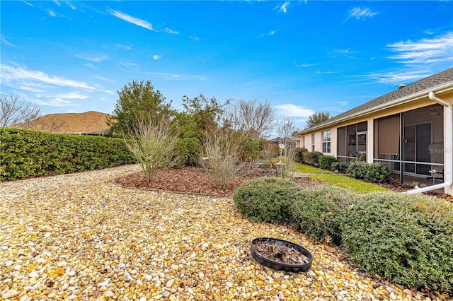 view of yard featuring a sunroom