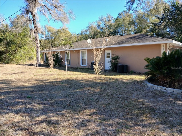 ranch-style house featuring a front yard