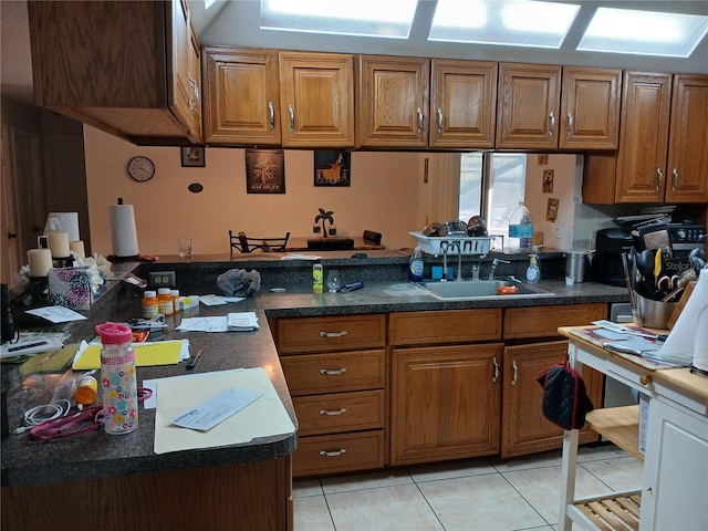 kitchen with light tile patterned flooring and sink