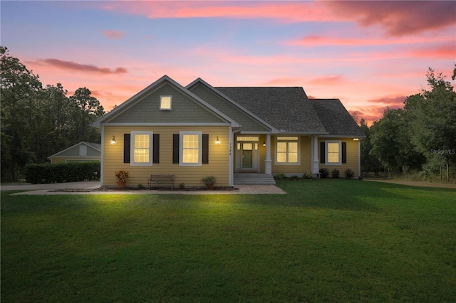 view of front of house with a yard