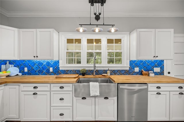 kitchen with butcher block counters, sink, white cabinetry, and stainless steel dishwasher