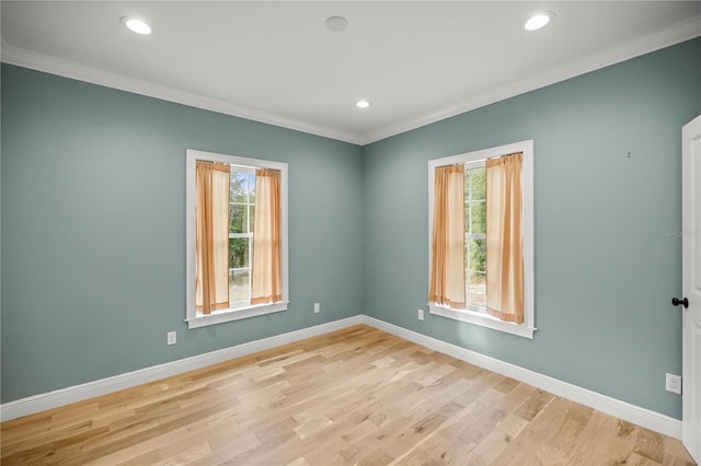 unfurnished room featuring crown molding and light hardwood / wood-style flooring