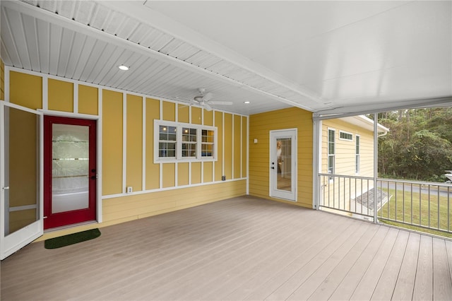 wooden terrace featuring ceiling fan