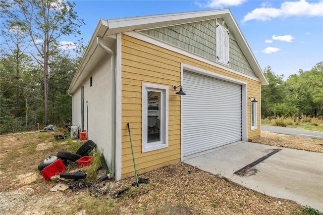 view of side of home featuring a garage