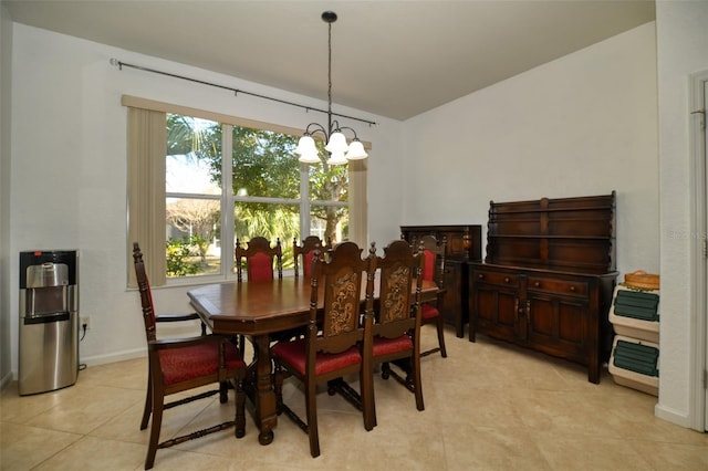 dining room featuring light tile patterned flooring and a chandelier